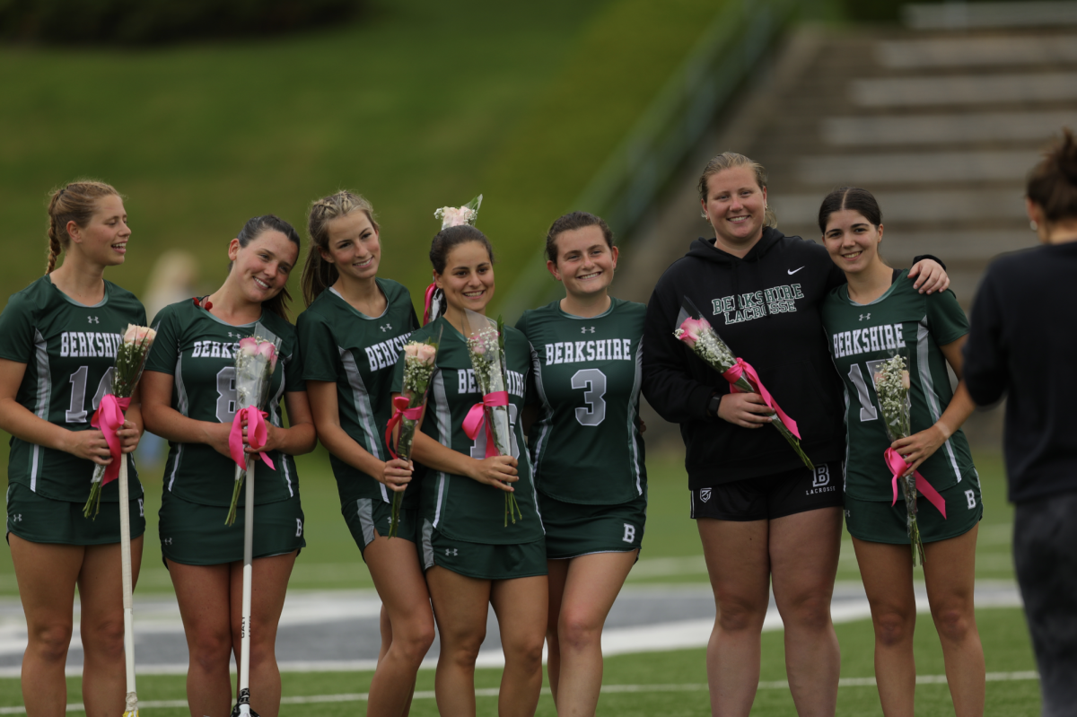 From left, seniors Maddie Jenks ’25, Alex Flynn ’25, Olivia Feeley ’25, Sofia Esposito ’25, Elle Dillmeier ’25, Ashley Sparkman ’25, and Emma Leahy ’25 on the turf before their 11-10 win against Deerfield